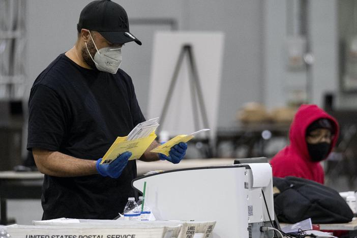 Working counts absentee ballots in Fulton County