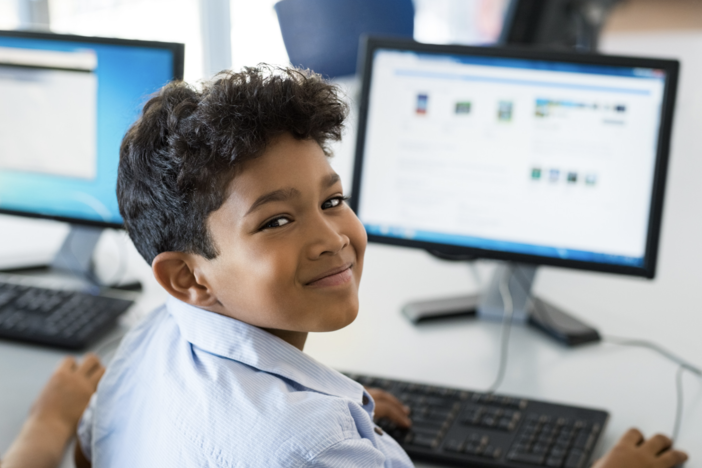 student in front of computer