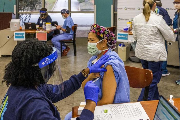Nurse receiving vaccine in Albany