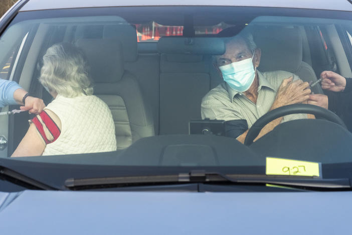 Marian, left, and Charlie Keen get vaccinated against COVID-19 on Cochran, Ga. in January 25, 2021.  