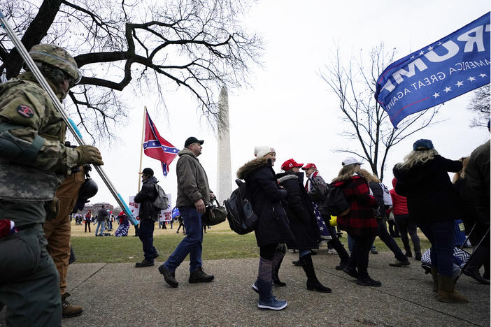 In this Jan. 6, 2021 photo, Trump supporters gather on the Washington Monument grounds in advance of a rally in Washington. Both within and outside the walls of the Capitol, banners and symbols of white supremacy and anti-government extremism were displayed as an insurrectionist mob swarmed the U.S. Capitol.