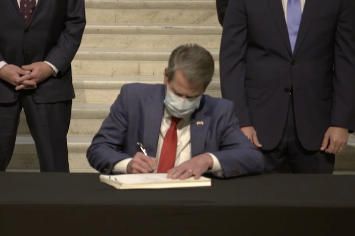 Gov. Brian Kemp signs amended FY21 budget.