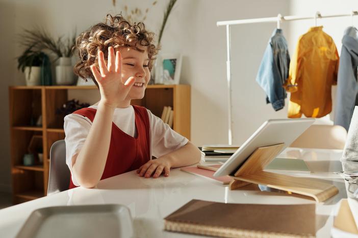 Child participating in virtual school