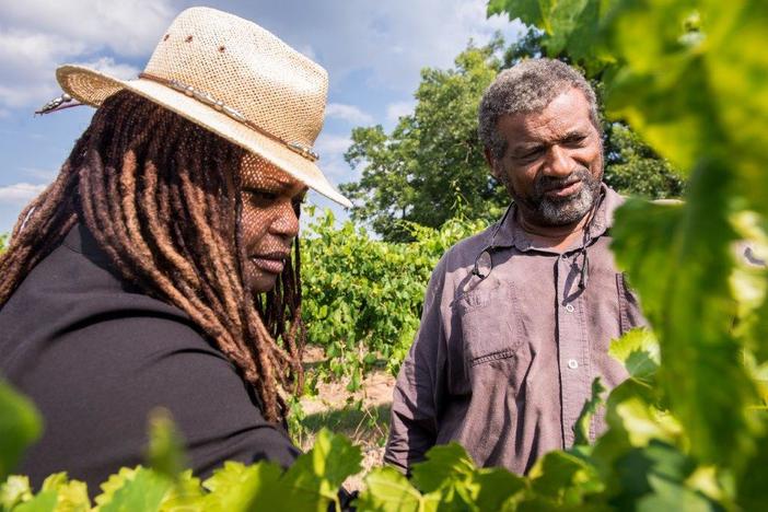 Veronica Womack, left, joins Howard James from Jibbs Vineyards in Byromville, Ga. 