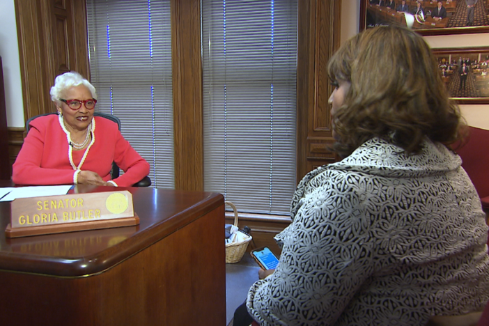 Georgia state Sen. Gloria Butler, left, speaks with Donna Lowry.