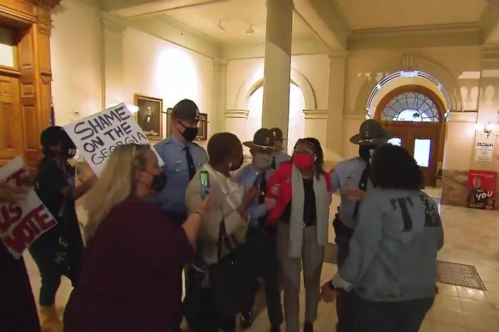 State Rep. Park Cannon (D-Atlanta) is arrested last night as Gov. Brian Kemp signs the new omnibus election law bill.