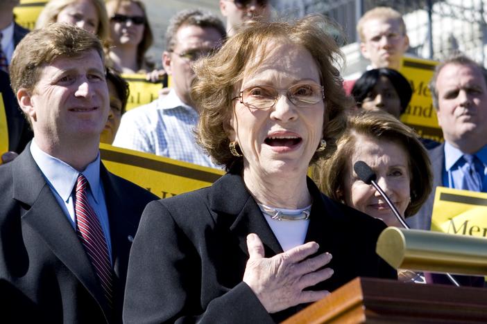 In this March 5, 2008 file photo, former first lady Rosalynn Carter, center, flanked by Rep. Patrick Kennedy, D-R.I., left, and House Speaker Nancy Pelosi of Calif., right, participates in rally on the Capitol Hill in Washington to discuss bipartisan mental health parity legislation.