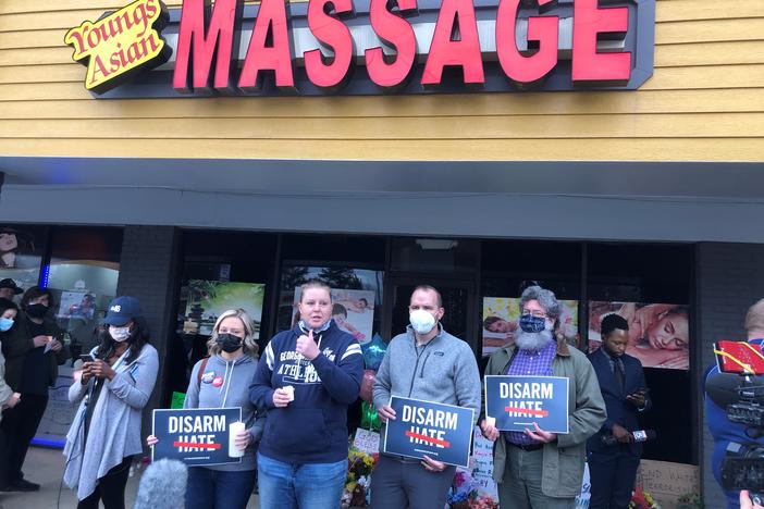 outside Young's Asian Massage during vigil