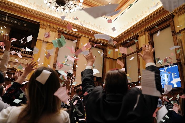 Legislators celebrate the end of the 2021 legislative session, in the Senate chamber at the State Capitol early Thursday, April 1, 2021, in Atlanta.