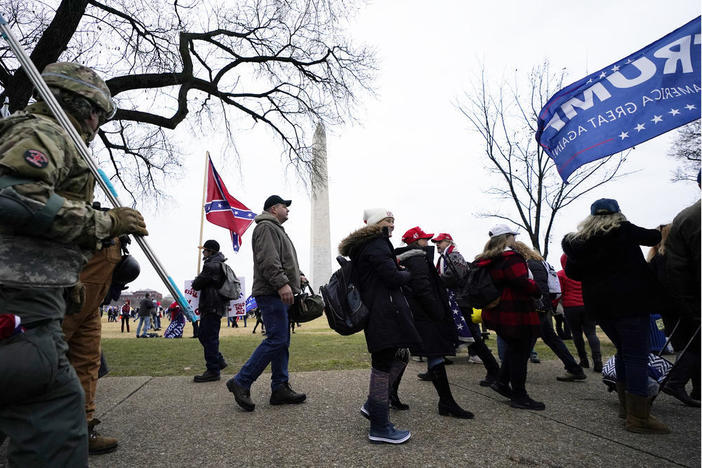 In this Wednesday, Jan. 6, 2021 file photo Trump supporters gather on the Washington Monument grounds in advance of a rally in Washington. Both within and outside the walls of the Capitol, banners and symbols of white supremacy and anti-government extremism were displayed as an insurrectionist mob swarmed the U.S. Capitol.