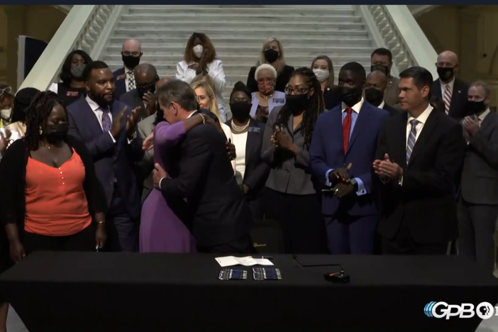 Gov. Brian Kemp hugs Wanda Cooper-Jones, mother of Ahmaud Arbery 