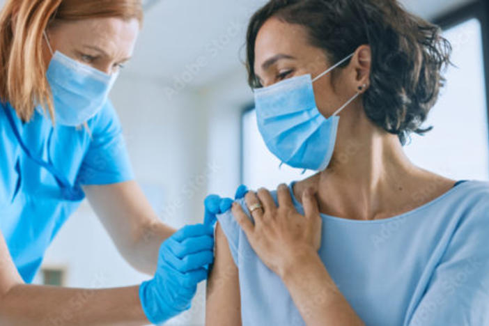 Nurse treating patient