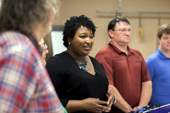 Stacey Abrams speaks to media during a 2018 campaign stop.