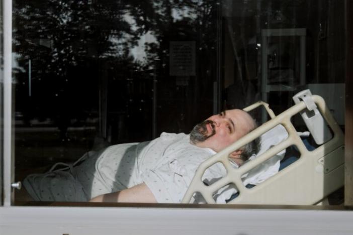 Man in hospital bed