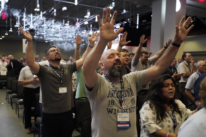 People take part in a worship service during the annual Southern Baptist Convention meeting Tuesday, June 15, 2021, in Nashville, Tenn. 