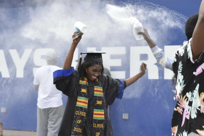 Grace Mbenza was surprised with baby powder confetti after graduating at Georgia State University's Center Parc Stadium in Atlanta in 2021. 