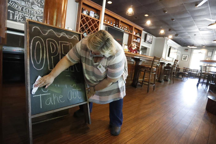 Mary Spoto, general manager of Madison Chop House Grille, prepares for the next shift in the file photo from Monday, April 27, 2020, in Madison, Ga. Most restrictions on restaurants were lifted over Memorial Day following an executive order from Ga. Gov. Brian Kemp.