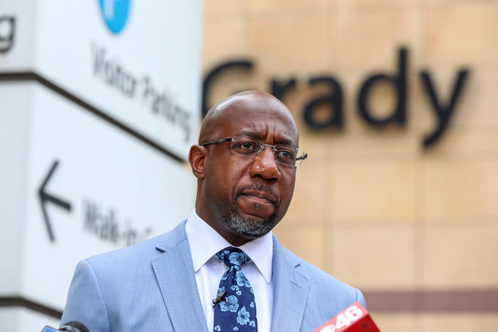 U.S. Sen. Raphael Warnock discusses his plan to bypass Georgia state officials' refusal to expand Medicaid outside of Grady Memorial Hospital in Atlanta on June 29.