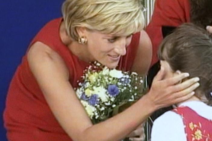 Princess Diana and a child.