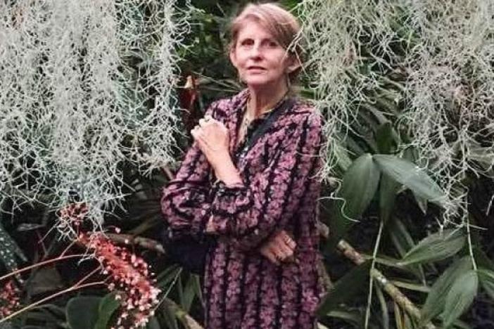 Margot Judd stands in a garden