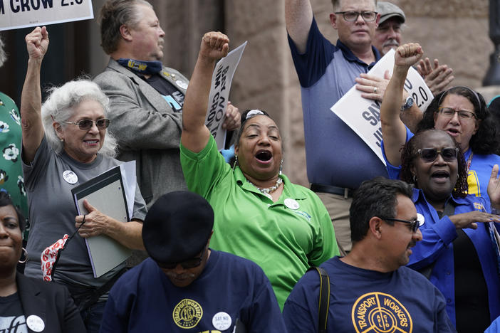 Demonstrators join a rally to protest proposed voting bills on the steps of the Texas Capitol, Tuesday, July 13, 2021, in Austin, Texas.