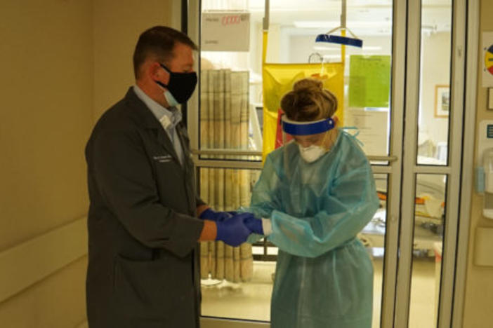 Nurse prays with hospital chaplain