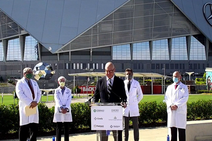 Doctors in metro Atlanta give a joint press conference outside Mercedes-Benz Stadium Aug. 19, 2021