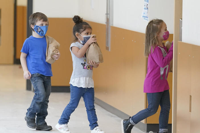 Kids carry lunches