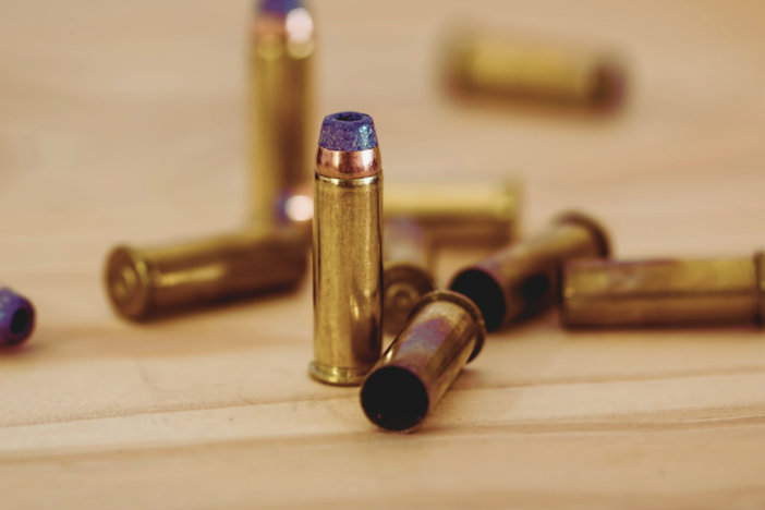 A group of bullets on a table.