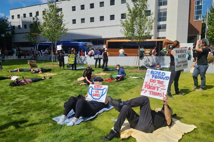 Staff and faculty at Georgia State University participate in a "die-in" protest Sept. 9, 2021, demanding more COVID-19 safety measures on campus.