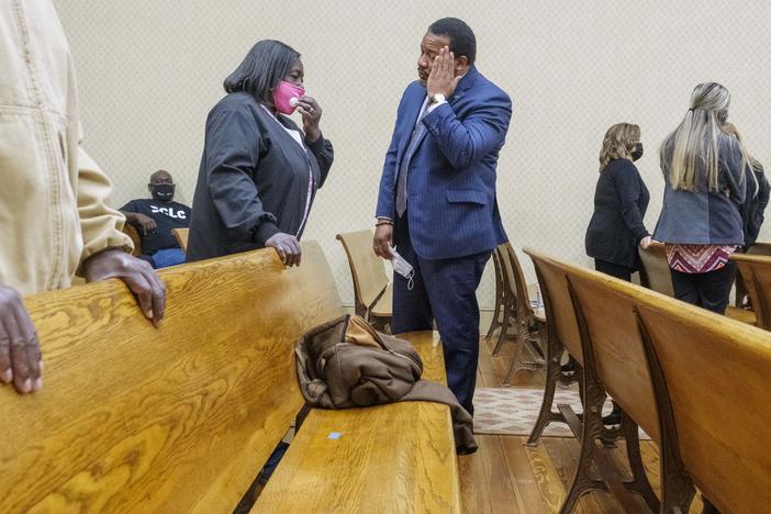 Attorney and civil rights activist Francys Johnson, right, talks with Helen Gilbert, the sister of Eurie Martin, during a break in the closing arguments in the murder trial of the three former Washington County Sheriff's Deputies in whose custody Martin died in 2017.