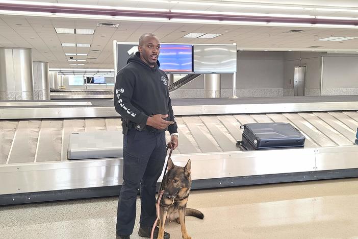 Clayton Officer Antonio Kendrick and K-9 Homer after inspecting luggage at the conference.