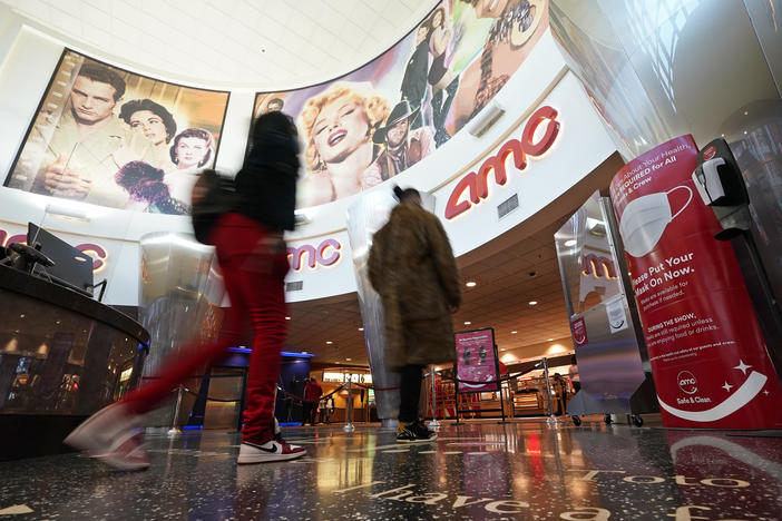Movie patrons arrive to see a film at the AMC 16 theater, Monday, March 15, 2021, in Burbank, Calif. 