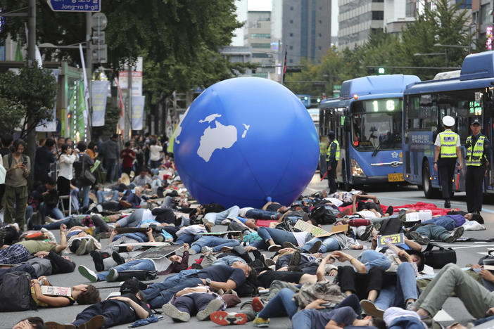 In this Saturday, Sept. 21, 2019 file photo, environmental activists stage a rally demanding action in stopping the climate crisis in Seoul, South Korea. The world's younger generations have become a vocal force in the debate over global warming.
