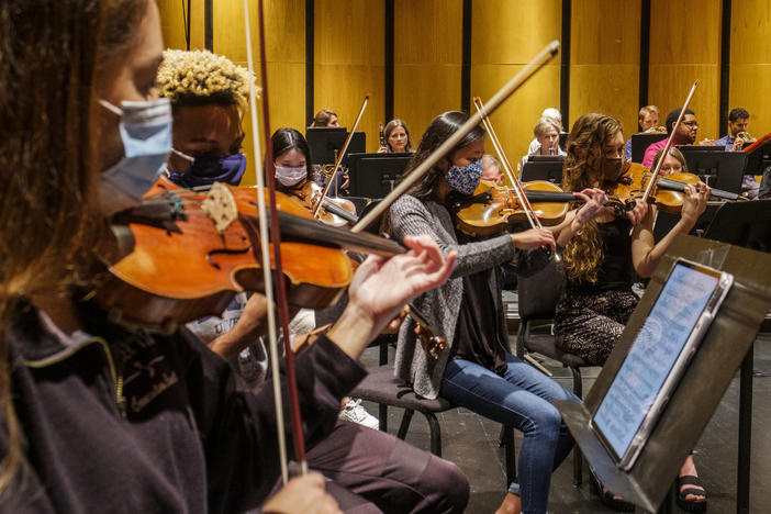The Macon Symphony Orchestra, comprised of students from the McDuffie Center for Strings and musicians from the Atlanta Symphony Orchestra, in rehearsal recently. 