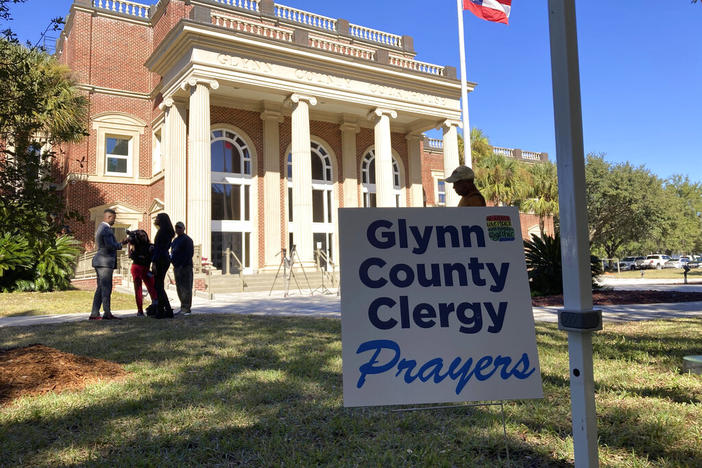 Black and white pastors have set up a tent and are asking for prayers during the trial over the death of Ahmaud Arbery at the Glynn County courthouse in Brunswick, Georgia, on Tuesday, Nov. 16, 2021. A call by a defense attorney to kick Black pastors out of the courtroom angered the community.