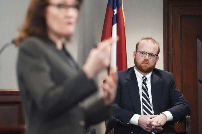 Defendant Travis McMichael testifies under cross-examination by prosecutor Linda Dunikoski at the Glynn County Courthouse on Thursday, Nov. 18, 2021 in Brunswick, Ga.