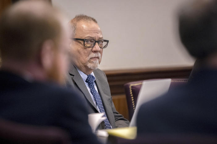 Greg McMichael, center, listens to arguments during the trial of himself, his son Travis McMichael, and a neighbor, William "Roddie" Bryan in the Glynn County Courthouse, Tuesday, Nov. 9, 2021, in Brunswick, Ga.