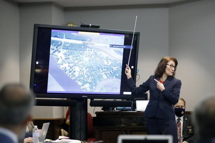 Prosecutor Linda Dunikoski speaks during opening statements in the trial of Greg McMichael and his son, Travis McMichael, and a neighbor, William "Roddie" Bryan at the Glynn County Courthouse, Friday, Nov. 5, 2021, in Brunswick, Ga.