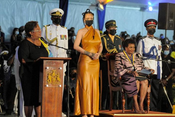 Barbados's Prime Minister Mia Mottley, left, asks the country's new president, Sandra Mason, seated at right, to make Barbadian singer Rihanna the country's 11th National Hero during a ceremony to declare Barbados a republic Tuesday.