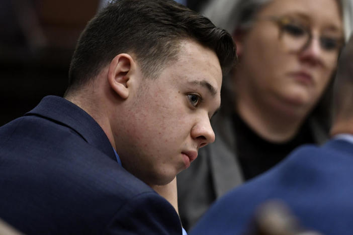 Kyle Rittenhouse listens as his attorney Mark Richards gives his closing argument during Rittenhouse's trial at the Kenosha County Courthouse on Nov. 15.