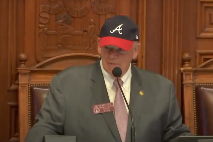 Speaker Dennis Ralston with Braves cap on during House special Session