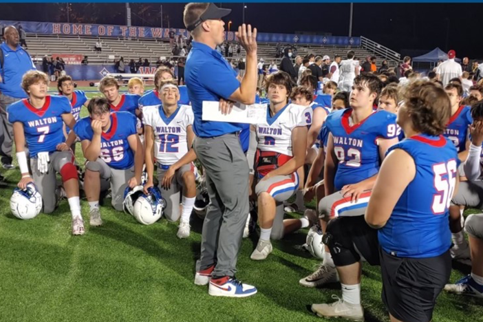 Walton Head Football Coach Daniel Brunner and team