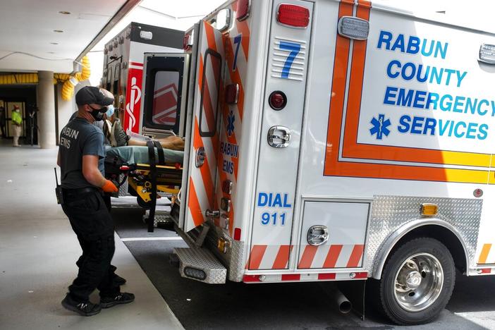 Ambulances from surrounding counties fill the emergency entrance Monday, Aug. 30, 2021, at the Northeast Georgia Medical Center Gainesville, Ga. Like most in Georgia, the hospital experienced a surge in COVID-19 patients as the state set a new mark for infections on Tuesday, Aug. 31.