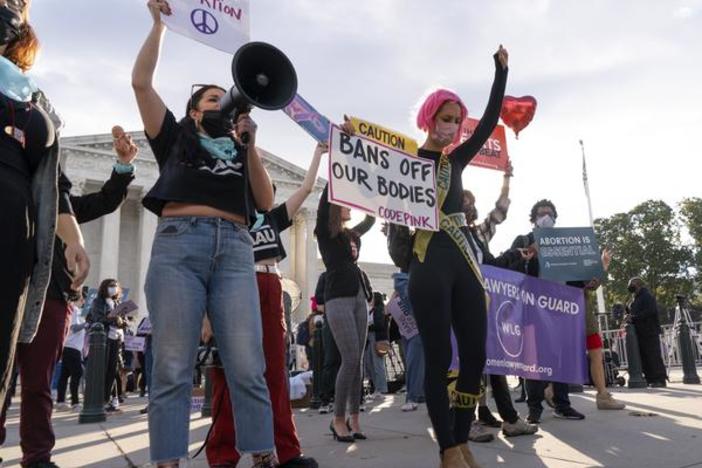 Abortion-rights supporters and opponents rally outside the Supreme Court in November, as the justices heard arguments about Texas' controversial abortion law.