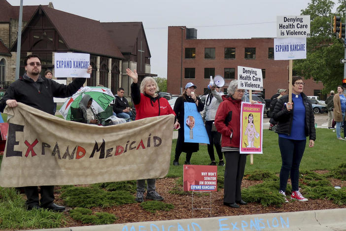 Advocates for expanding Medicaid in Kansas staged a protest outside the entrance to the statehouse parking garage in Topeka in May 2019. 
