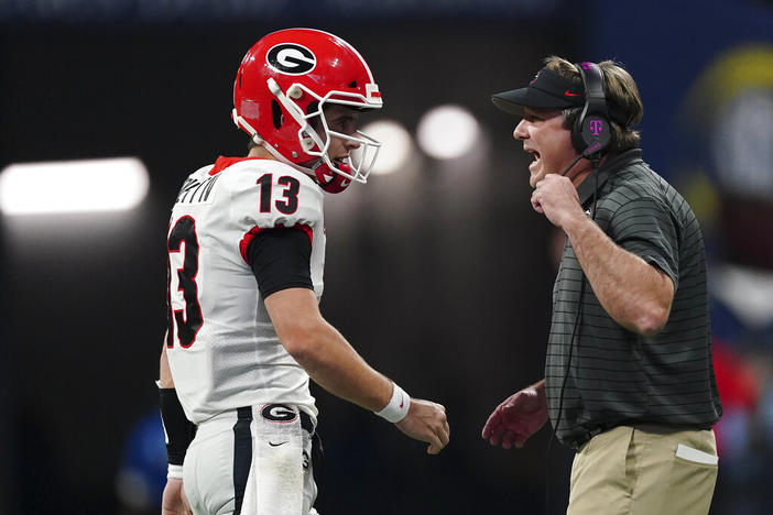 Georgia head coach Kirby Smart speaks on the field during the first half of the Southeastern Conference championship NCAA college football game against Alabama, Saturday, Dec. 4, 2021, in Atlanta.