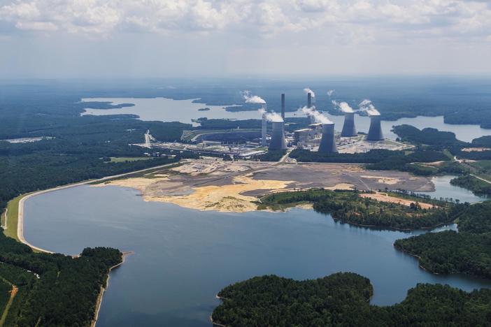 The coal ash pond, foreground, where waste from Georgia Power's coal fired Plant Scherer is stored. The EPA said it will not allow coal ash to be stored in contact with groundwater as it is now at Plant Scherer. 