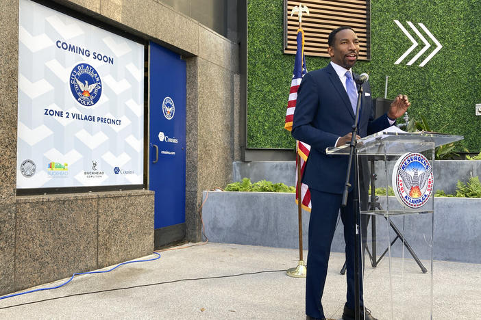 Atlanta Mayor Andre Dickens unveils a new police precinct in the Atlanta's Buckhead district Thursday, Jan. 13, 2022, as he tries to head off an effort to turn the wealthy, white enclave into its own city over concerns about a spike in crime.