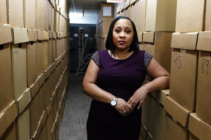 Fulton County District Attorney Fani Willis poses for a photo at her office, Feb. 24, 2021 in Atlanta. The Georgia prosecutor who’s investigating possible attempts to interfere in the 2020 general election by former President Donald Trump and others has asked for a special grand jury to aid the investigation. Willis, on Thursday, Jan. 20, 2022, sent a letter to Fulton County Superior Court Chief Judge Christopher Brasher asking him to impanel a special grand jury.